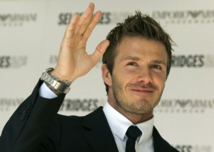 England footballer David Beckham waves to photographers at an event to promote the Emporio Armani men's underwear collection in London